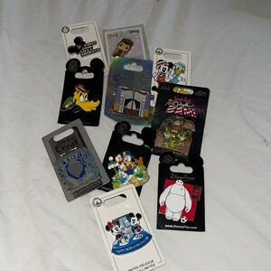 Disney Pin Lot of 10. Authentic Disney pins still with backing.